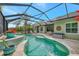 Large, screened-in pool and spa with plenty of sun at 12386 Sagewood Dr, Venice, FL 34293