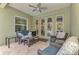 Covered patio with comfortable seating overlooking the pool at 12386 Sagewood Dr, Venice, FL 34293