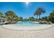 Enjoy this resort-style pool with a water slide and shaded seating areas at 12386 Sagewood Dr, Venice, FL 34293