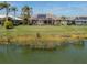 Home with solar panels and screened pool area, lake view at 1374 Brenner Park Dr, Venice, FL 34292