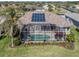 Home features solar panels, screened pool and spa at 1374 Brenner Park Dr, Venice, FL 34292
