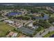 Aerial view of community amenities including tennis courts at 1374 Brenner Park Dr, Venice, FL 34292