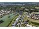 Community overview showcasing waterfront property and golf course at 1374 Brenner Park Dr, Venice, FL 34292