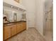 Bathroom with double vanity, granite countertop and a large walk-in shower at 1374 Brenner Park Dr, Venice, FL 34292