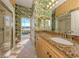 Spa-like bathroom with granite vanity, walk-in shower, and view of pool at 1374 Brenner Park Dr, Venice, FL 34292
