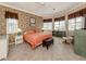 Main bedroom with coral bedding and built-in shelving at 1374 Brenner Park Dr, Venice, FL 34292
