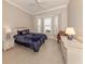 Guest bedroom with bay window and built-in dresser at 1374 Brenner Park Dr, Venice, FL 34292