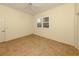 Bright bedroom with tile flooring and double-paned windows at 1374 Brenner Park Dr, Venice, FL 34292