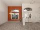 Bright entryway with double doors and an accent wall at 1374 Brenner Park Dr, Venice, FL 34292