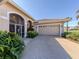 Attached garage with double door and landscaping at 1374 Brenner Park Dr, Venice, FL 34292