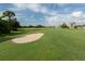Expansive green golf course with sand traps at 1374 Brenner Park Dr, Venice, FL 34292