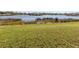 Scenic view of a tranquil lake and lush landscaping at 1374 Brenner Park Dr, Venice, FL 34292