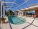 Spacious pool and spa with screened enclosure and solar panels at 1374 Brenner Park Dr, Venice, FL 34292