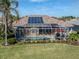 Home with solar panels and screened pool and spa at 1374 Brenner Park Dr, Venice, FL 34292