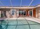 Relaxing pool and spa with screened enclosure and lake view at 1374 Brenner Park Dr, Venice, FL 34292