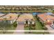 Single-Gathering home with a tile roof and a two-car garage at 13836 Karina St, Venice, FL 34293