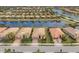 Three homes nestled together near a lake in a quiet community at 13836 Karina St, Venice, FL 34293