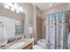 Clean bathroom with tub shower and granite vanity at 13836 Karina St, Venice, FL 34293
