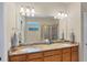 Bathroom boasts double sinks and granite countertop at 13836 Karina St, Venice, FL 34293