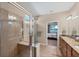 Spa-like bathroom with walk-in shower and view to bedroom at 13836 Karina St, Venice, FL 34293