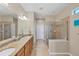 Elegant bathroom with double vanity and large shower at 13836 Karina St, Venice, FL 34293