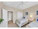 Guest bedroom with twin beds and access to hallway at 13836 Karina St, Venice, FL 34293