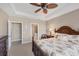 Comfortable bedroom with king bed and en-suite bathroom at 13836 Karina St, Venice, FL 34293