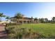 Community clubhouse with a spacious lawn at 13836 Karina St, Venice, FL 34293