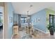 Elegant dining room with light blue walls and a wood dining table at 13836 Karina St, Venice, FL 34293