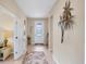Bright entryway with tile floors and a decorative wall piece at 13836 Karina St, Venice, FL 34293