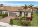 One-story house with a tile roof and palm trees in the front yard at 13836 Karina St, Venice, FL 34293
