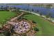 Landscaped fire pit area with seating at 13836 Karina St, Venice, FL 34293