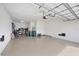 Spacious two-car garage with ample storage shelving and flooring at 13836 Karina St, Venice, FL 34293