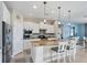 Spacious kitchen boasts granite countertops and white cabinetry at 13836 Karina St, Venice, FL 34293