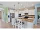 Modern kitchen with stainless steel appliances and granite countertops at 13836 Karina St, Venice, FL 34293