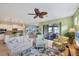 Living room with a view of the kitchen and patio at 13836 Karina St, Venice, FL 34293