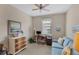 Charming office features a desk, comfortable seating, and ceiling fan at 13836 Karina St, Venice, FL 34293