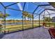 Enjoy the view from this screened enclosure with brick pavers at 13836 Karina St, Venice, FL 34293