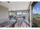 Large screened patio, wicker furniture, and lake view at 13836 Karina St, Venice, FL 34293