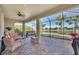 Screened patio with comfortable seating and lake view at 13836 Karina St, Venice, FL 34293
