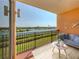 Spacious balcony overlooking waterfront with seating area at 157 Tampa E Ave # 407, Venice, FL 34285