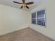 Bedroom with tile flooring, plantation shutters and ceiling fan at 157 Tampa E Ave # 407, Venice, FL 34285