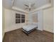 Bedroom with wood flooring, wall bed, and plantation shutters at 157 Tampa E Ave # 407, Venice, FL 34285