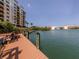 Relaxing boardwalk with water views and a nearby building at 157 Tampa E Ave # 407, Venice, FL 34285