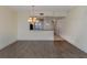 Open concept dining room with kitchen access and hardwood floors at 157 Tampa E Ave # 407, Venice, FL 34285