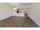Open concept dining room with hardwood floors and kitchen access at 157 Tampa E Ave # 407, Venice, FL 34285