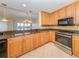Spacious kitchen with wood cabinets and granite countertops at 157 Tampa E Ave # 407, Venice, FL 34285