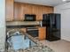 Modern kitchen with granite countertops and wood cabinets at 157 Tampa E Ave # 407, Venice, FL 34285