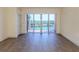 Bright living room with water views and sliding glass doors leading to a balcony at 157 Tampa E Ave # 407, Venice, FL 34285