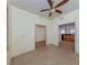 Spacious living area with tile floors and ceiling fan at 157 Tampa E Ave # 407, Venice, FL 34285